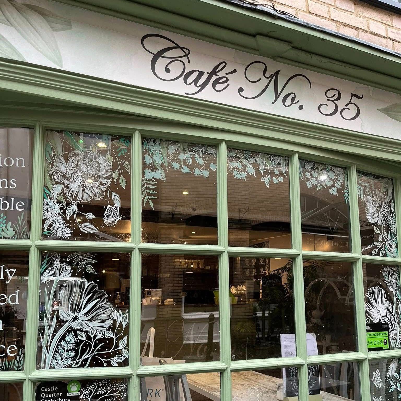 Café No. 35 storefront with beautiful botanical window decorations